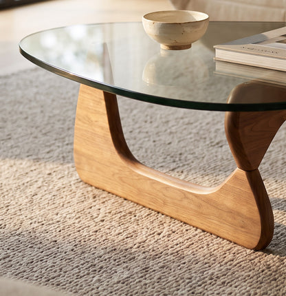 Environmental close-up of the glass-top coffee table in a living room setting
