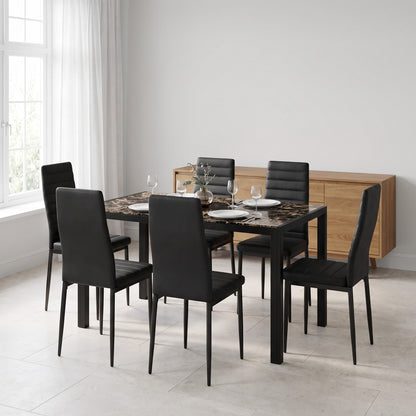 Glass dining table with six black chairs in a bright kitchen dining nook
