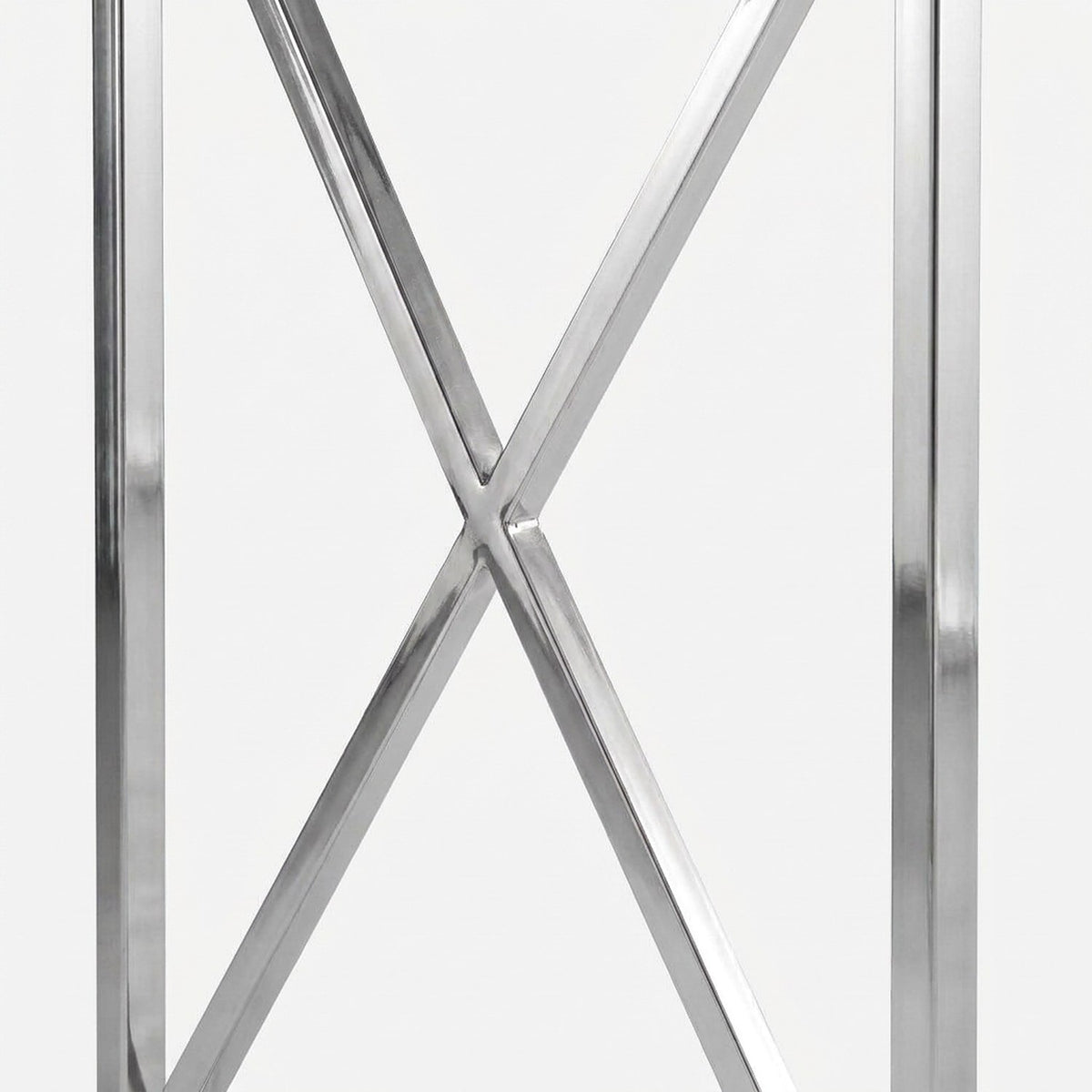 Polished chrome X-brace on the desk end frame (close-up detail)