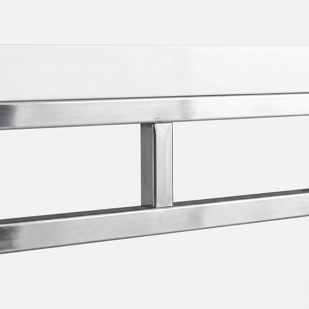 Glossy top edge resting on the chrome side rails (close-up detail)