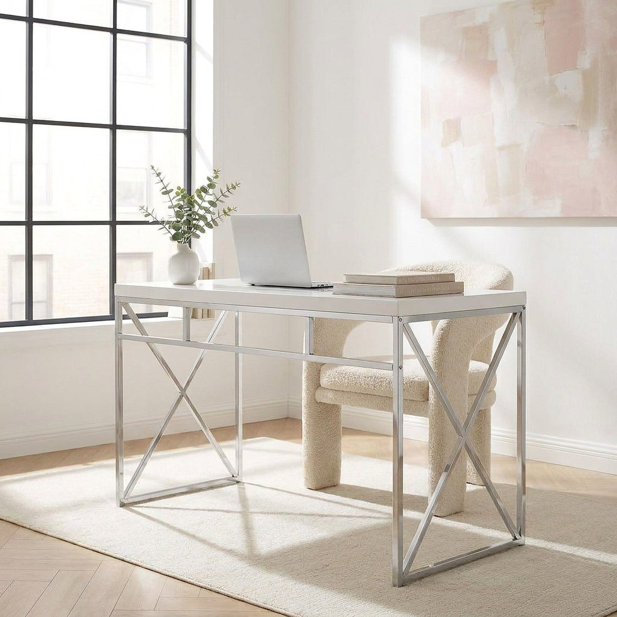 Closer corner view of the white desk beside a large window