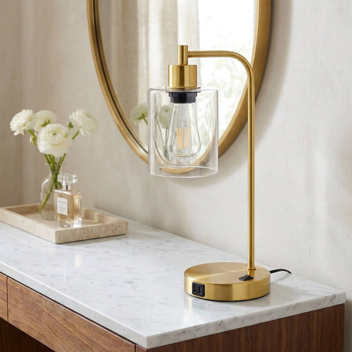 Gold lamp on the marble vanity beside white ranunculus, closer view in the same dressing room (room)