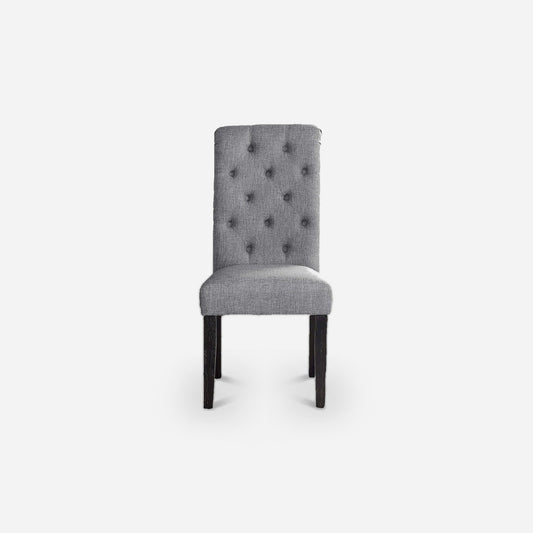 Gray linen-look tufted dining chair with rolled high back and dark wood legs