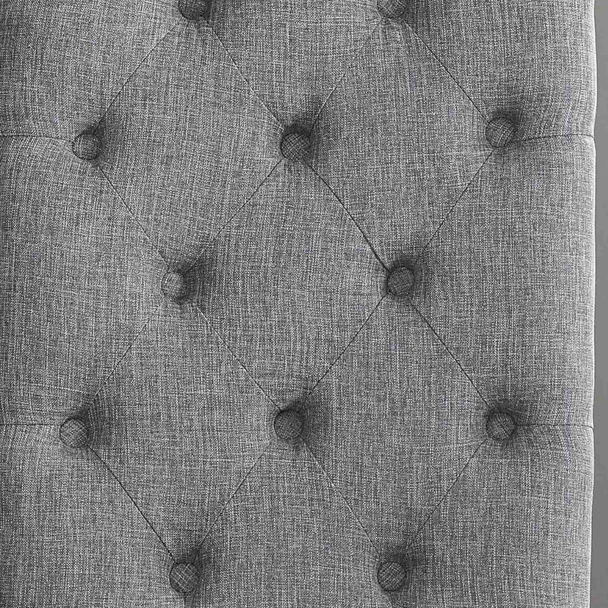 Close-up of the diamond button tufting on the gray linen-look back