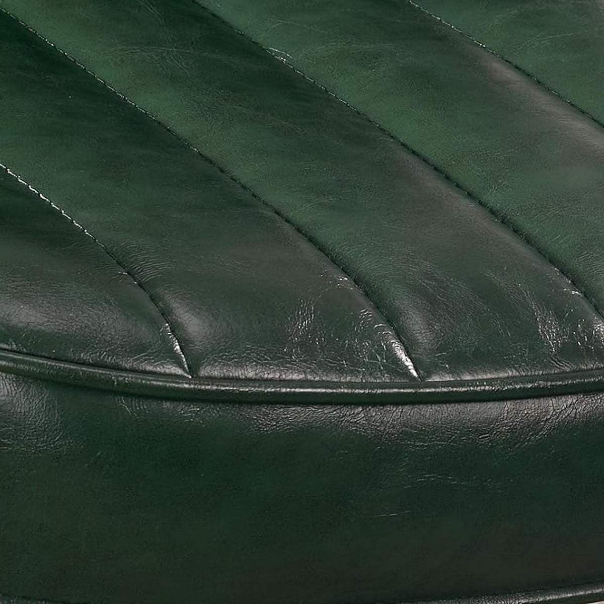 Close-up of the green leather seat with channel stitching (close-up detail)