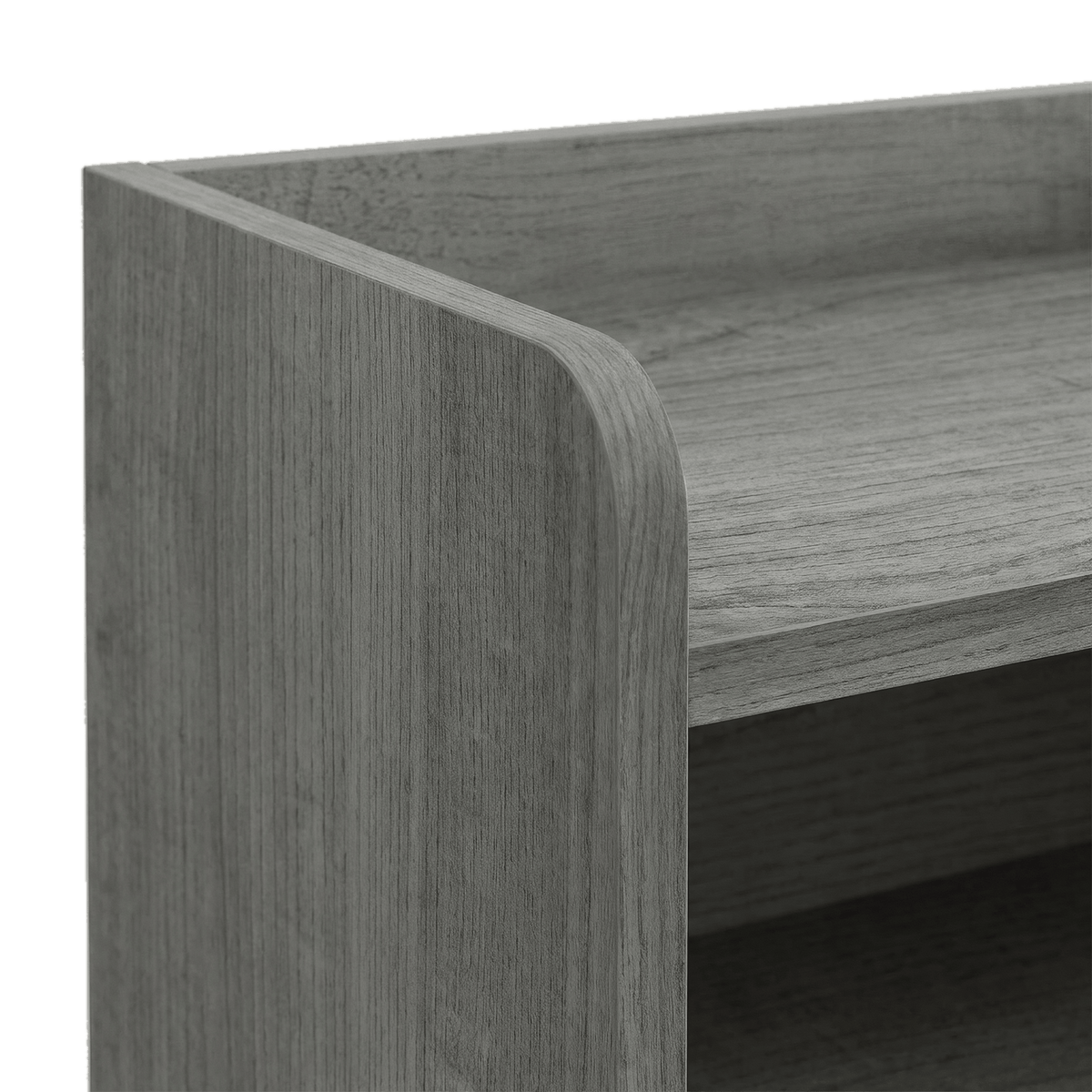 Close-up of the raised back lip and rounded corner on the grey wood-look panel (close-up detail)