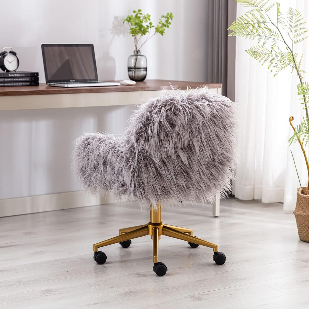 Grey faux-fur office chair with adjustable height and chrome base on a wheeled five-star base.