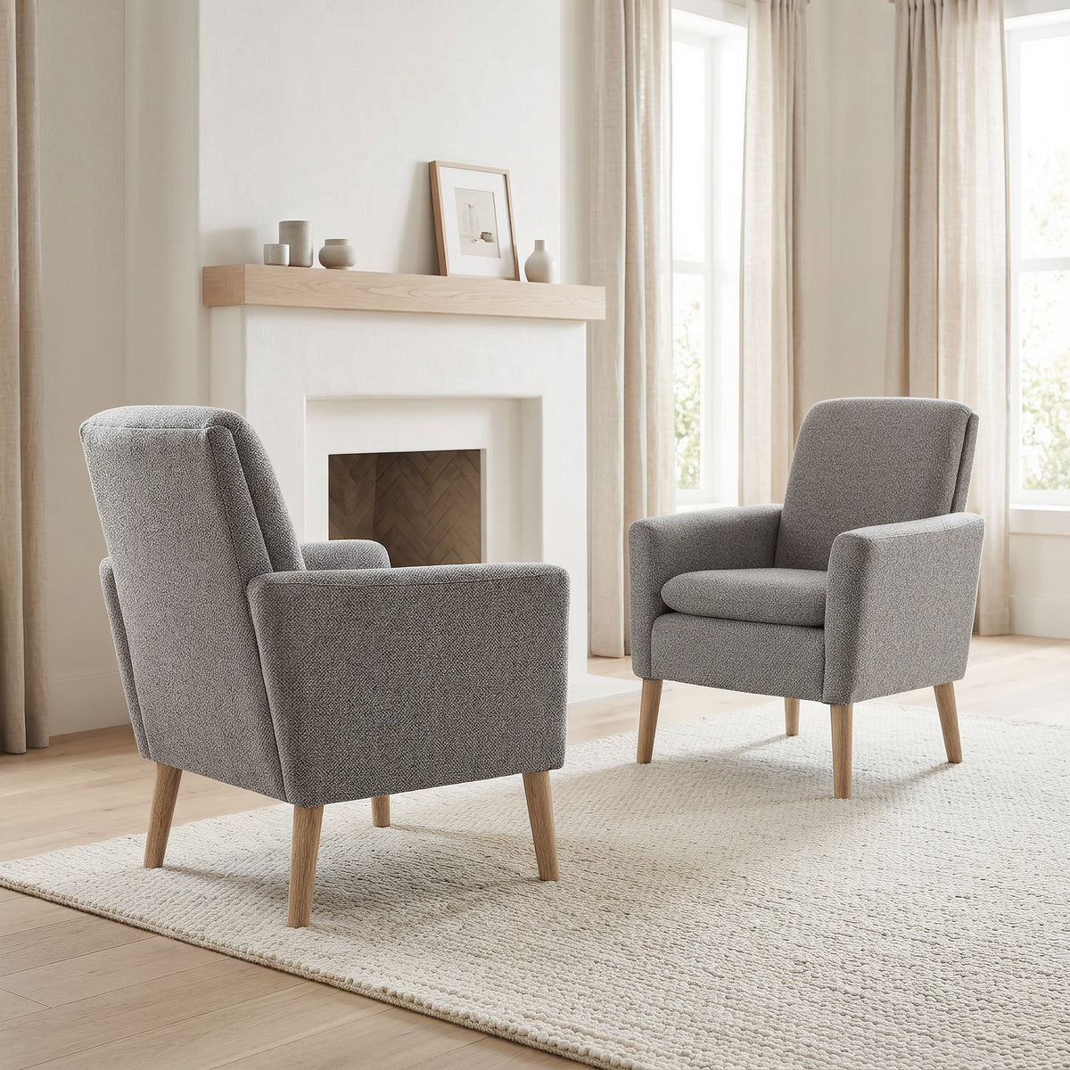 Pair of grey linen armchairs in a bright living room