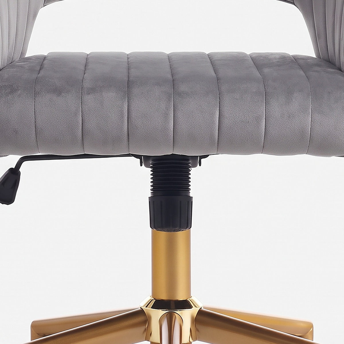 Rounded front edge of the channel-seamed velvet seat above the gas lift (close-up detail)