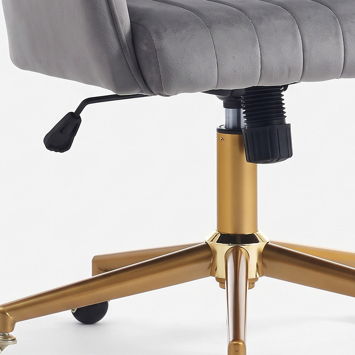 Black height lever, gas-lift housing and gold-finish column under the seat (close-up detail)