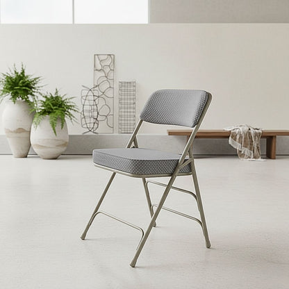 2-pack of Hercules series folding chairs with gray fabric cushioned seats and heavy-duty steel frames, ideal for high-capacity event seating.