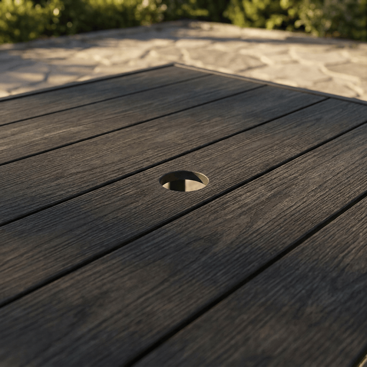 Table circular umbrella hole close-up outdoors (close-up detail)