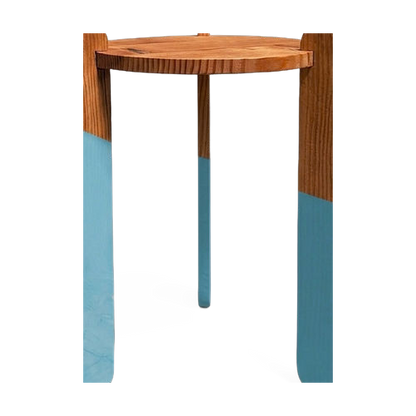 Center crossing leg and color-dip finish detail on the side table