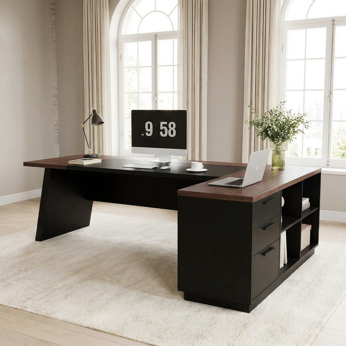 Walnut and black L shaped desk with three drawers and open shelves in a bright greige office with tall arched windows, seen lower from the right