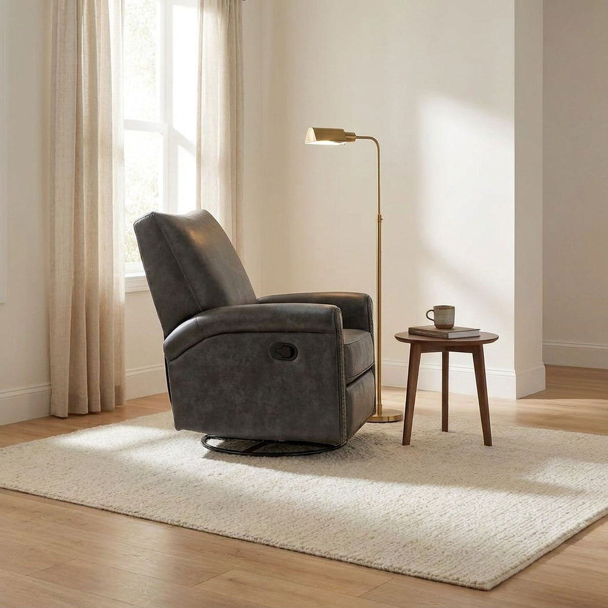 Wide view of the dark gray leather swivel recliner chair on a cream wool rug in a sunlit sitting room