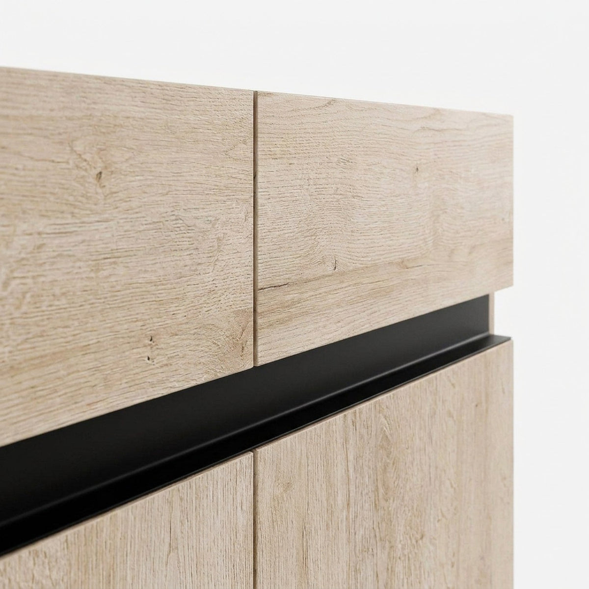 Oak-grain drawer fronts above the black recessed pull strip, close-up detail