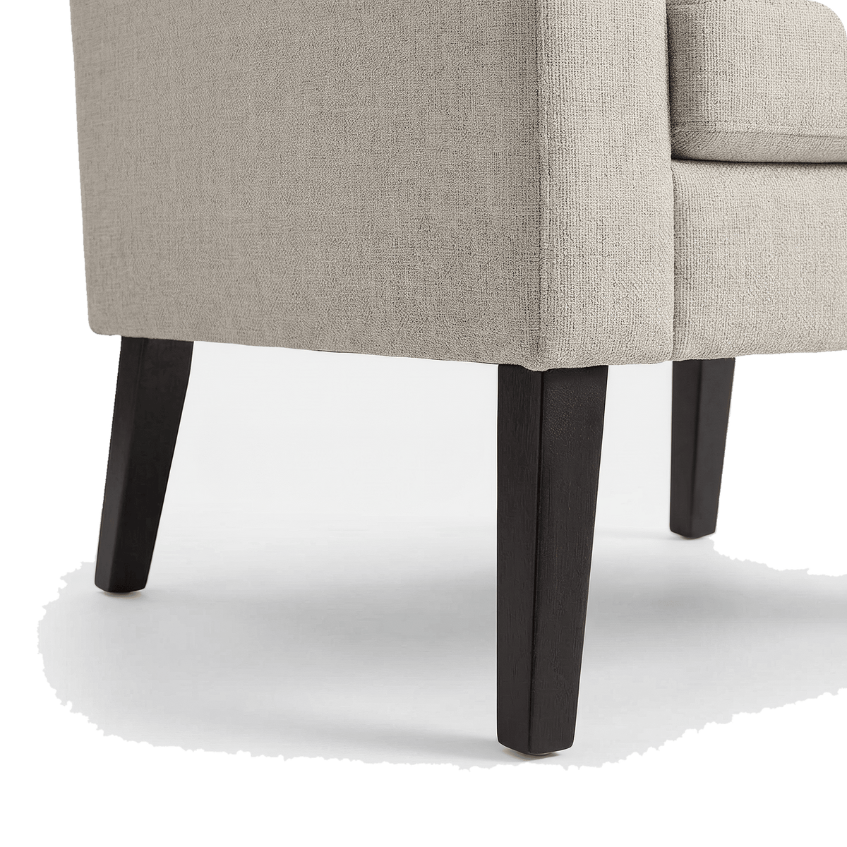 Splayed dark rubber wood leg of the linen accent chair (close-up detail)
