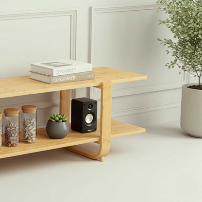 Low-profile two-tier bamboo TV storage unit with a warm burlywood finish, designed to support 65-inch televisions in small living spaces.