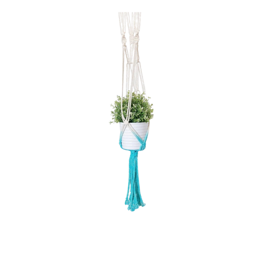 Aquamarine dip dye macrame plant hanger handmade in Canada holding a white ribbed pot, front view (plain studio)
