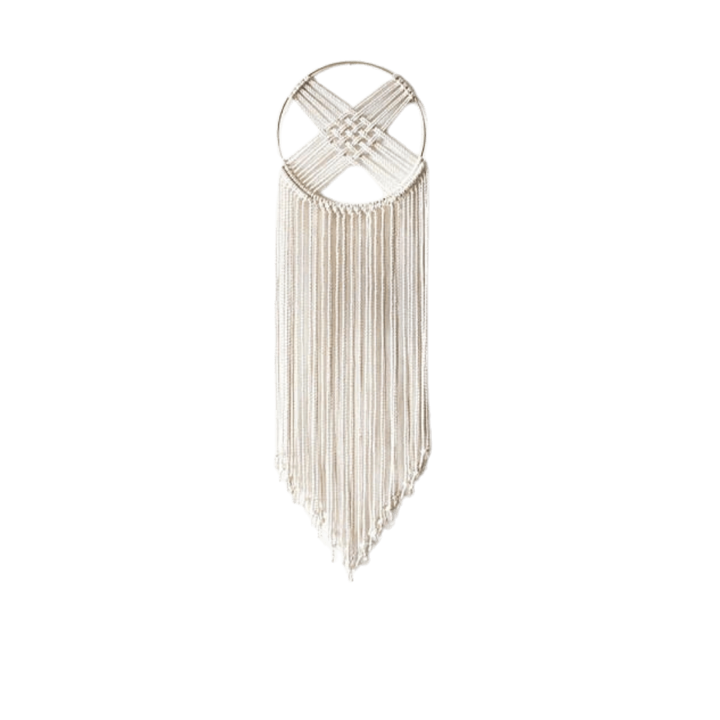 Macrame dreamcatcher wall hanging on a gilded brass hoop with long ivory fringe, front view (plain studio)