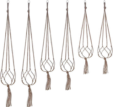 Beige macrame plant hanger with tassels on a white background