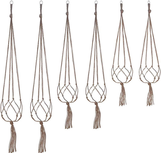 Set of six macrame plant hangers with tassels on a white background