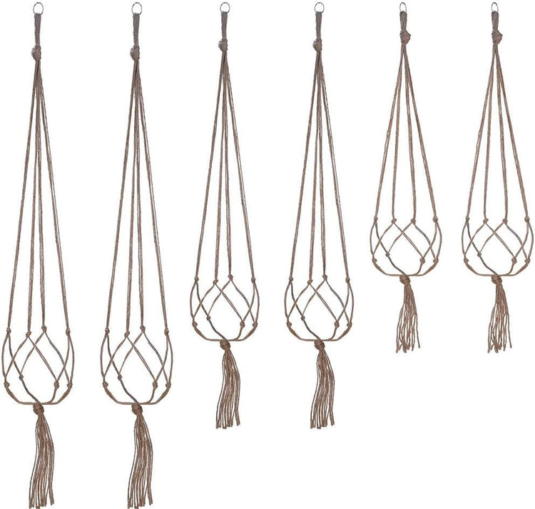 Set of six macrame plant hangers with tassels on a white background