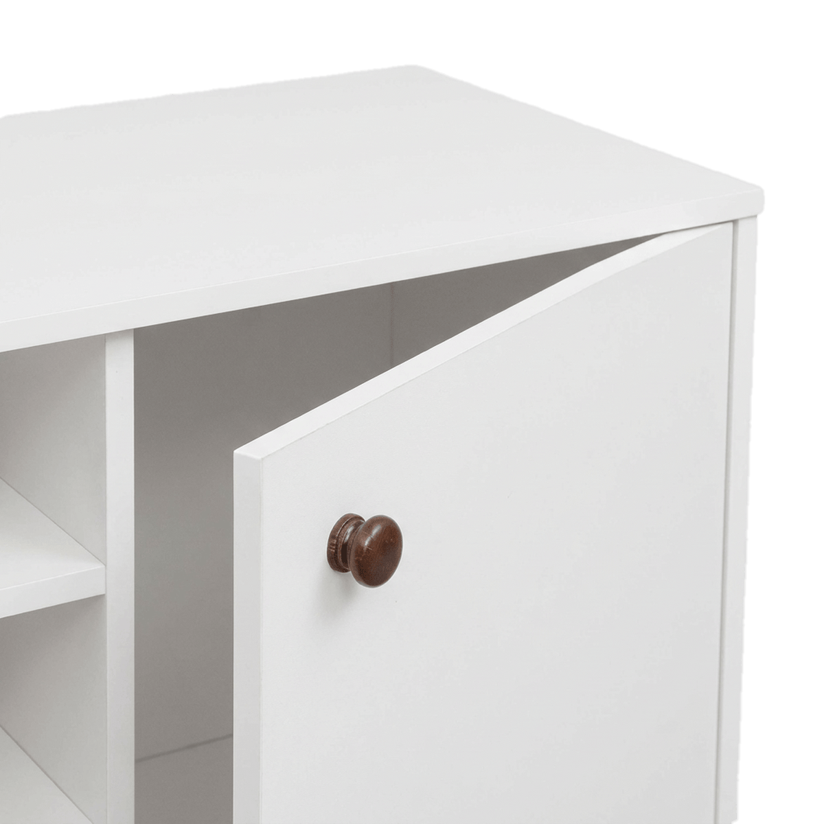 White cabinet door slightly open with its round walnut-tone knob (close-up detail)