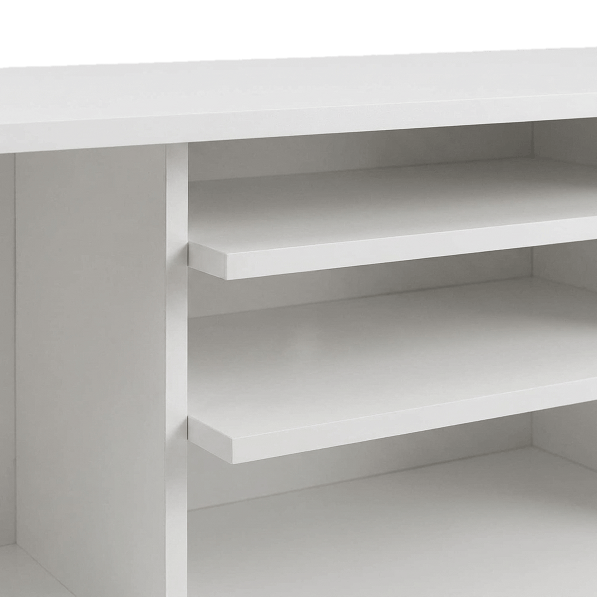 Two centre shelves and the divider of the white TV stand (close-up detail)