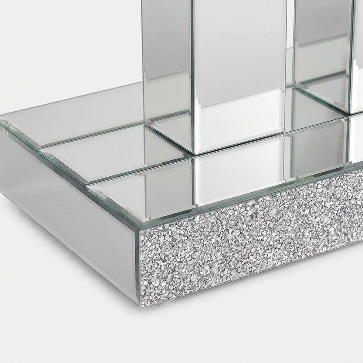 Corner of the mirrored plinth base (close-up detail)