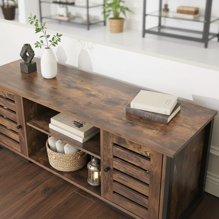 Modern mid-century industrial TV stand with louvered doors in dark wood, open shelves and hidden storage.
