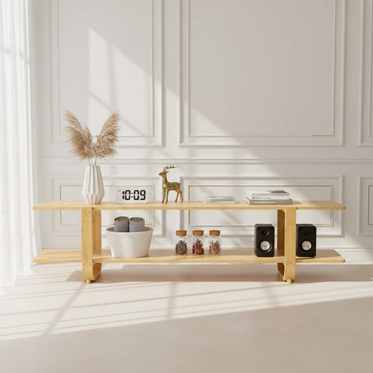 65-inch bamboo TV stand with storage shelves in a bright white room.