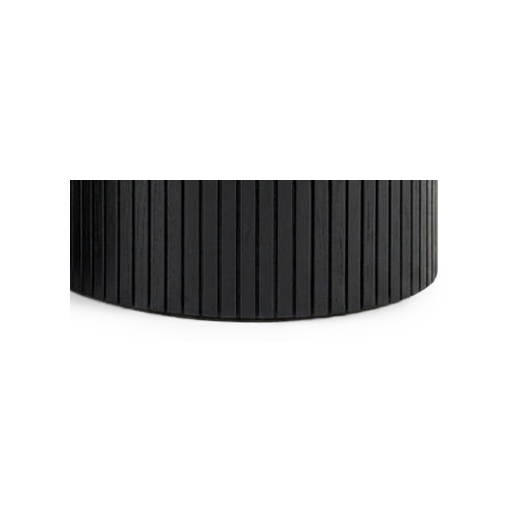Fluted drum base sitting flat on its full rim with no legs (close-up detail)