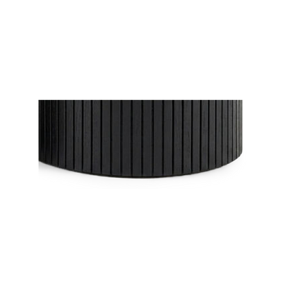 Fluted drum base sitting flat on its full rim with no legs (close-up detail)