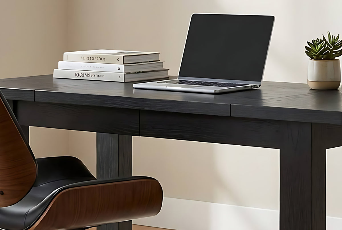 Black wood office desk, close-up of the desktop with laptop and chair