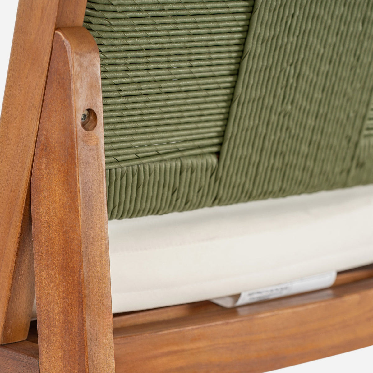 Green hand-woven wicker back and acacia post, close up