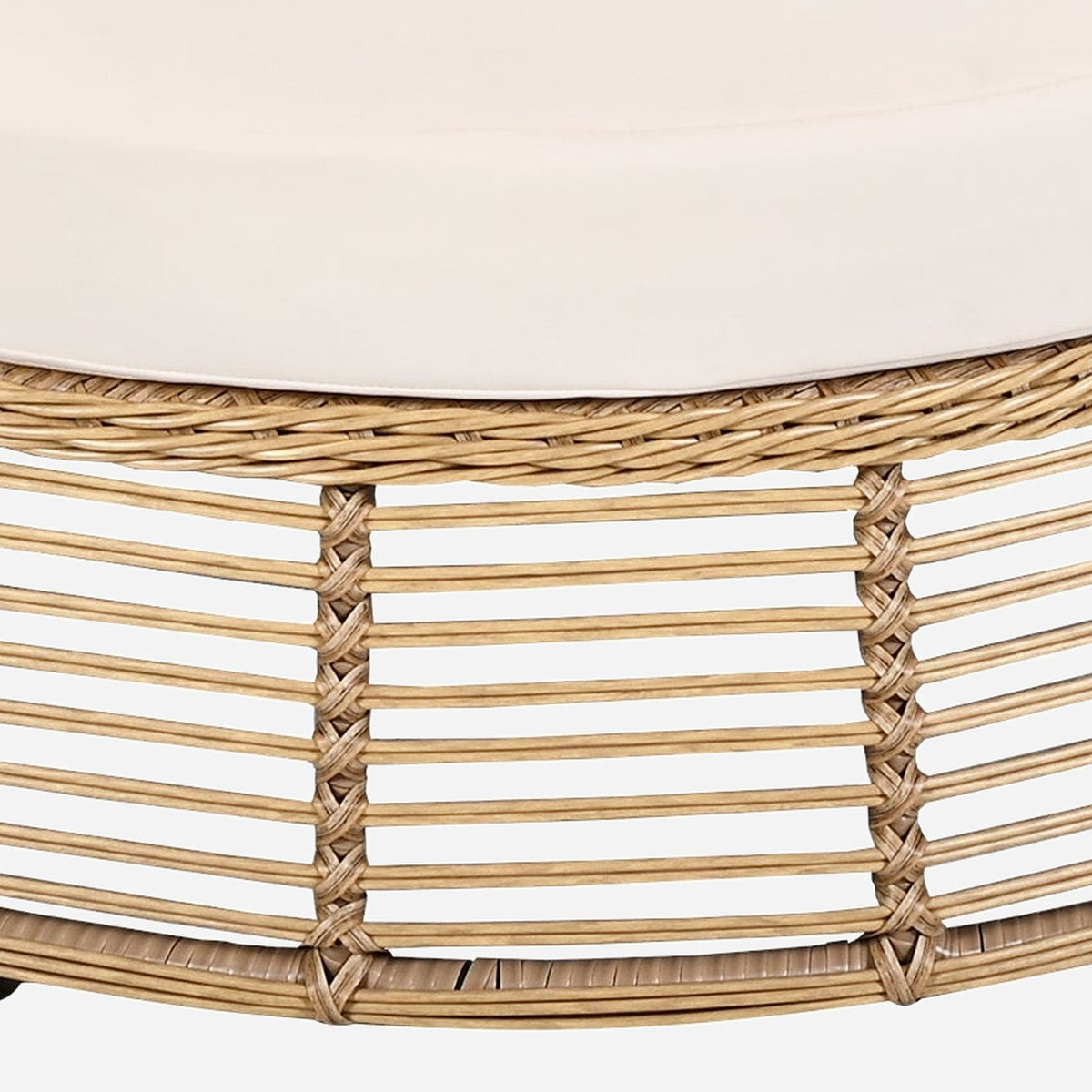 Close-up of the woven wicker band and open slats under the cushion