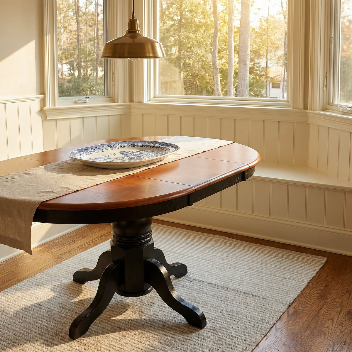 Extended oval kitchen table in a bay-window breakfast nook, closer view