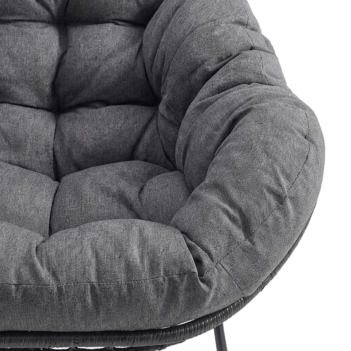 Tufted dark gray padded cushion and rolled edge on the rattan bowl (close-up detail)