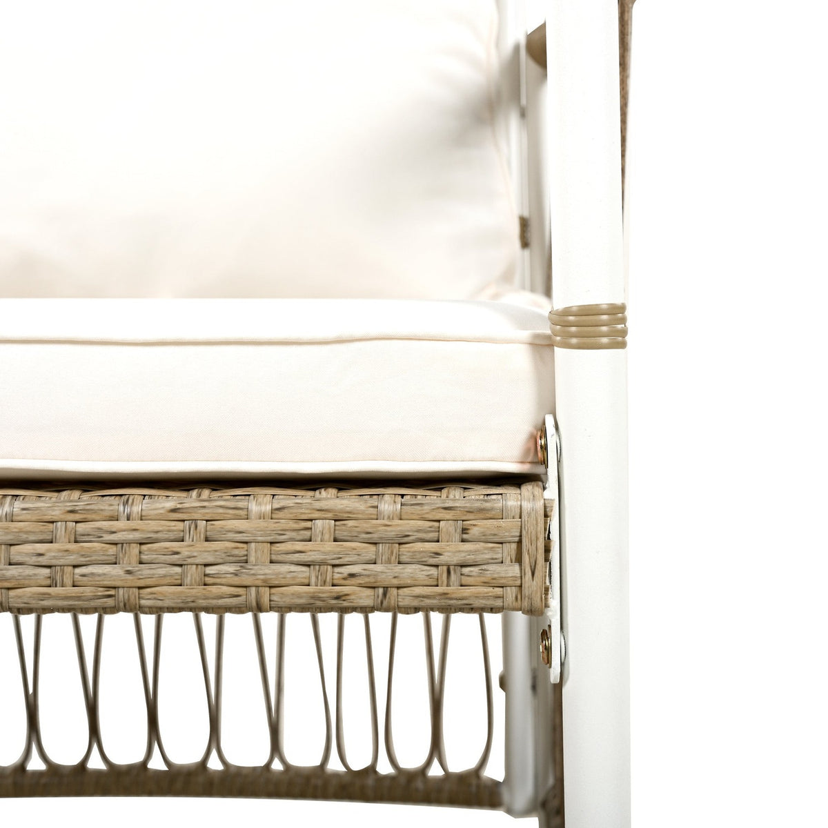 Cream cushion over the woven rattan seat rail (close-up detail)