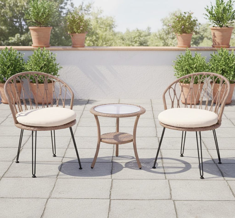 Outdoor patio set with two chairs and a table on a stone patio, surrounded by potted plants.