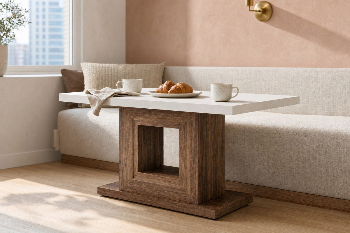 Pedestal dining table set for breakfast for two in a sunny nook