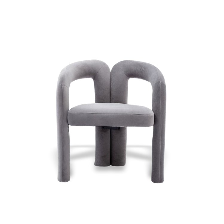 Velvet dining armchair with curved back and plush velvet upholstery.