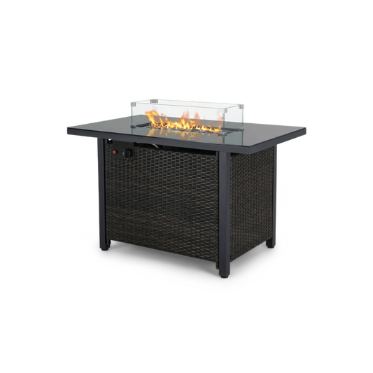 Rattan fire pit table with glass windshield and black top, shown at an angle