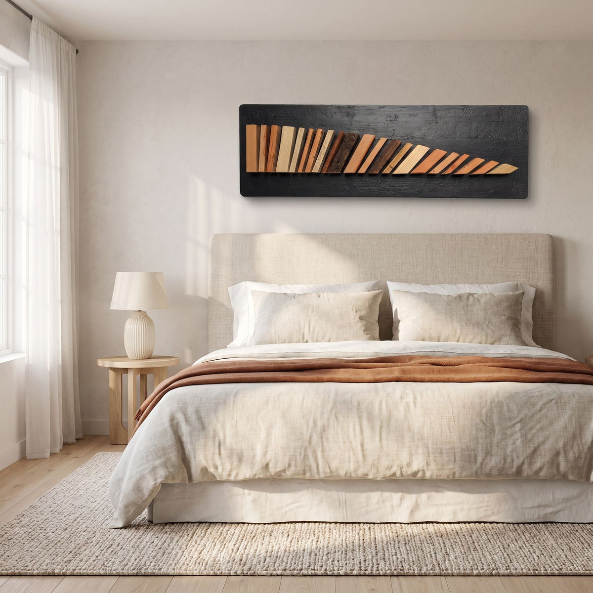 Wood wall sculpture above a linen headboard in a bright bedroom