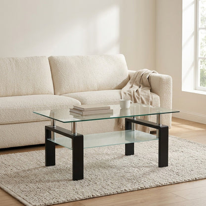 Black rectangular glass coffee table with shelf styled in front of a living room sofa
