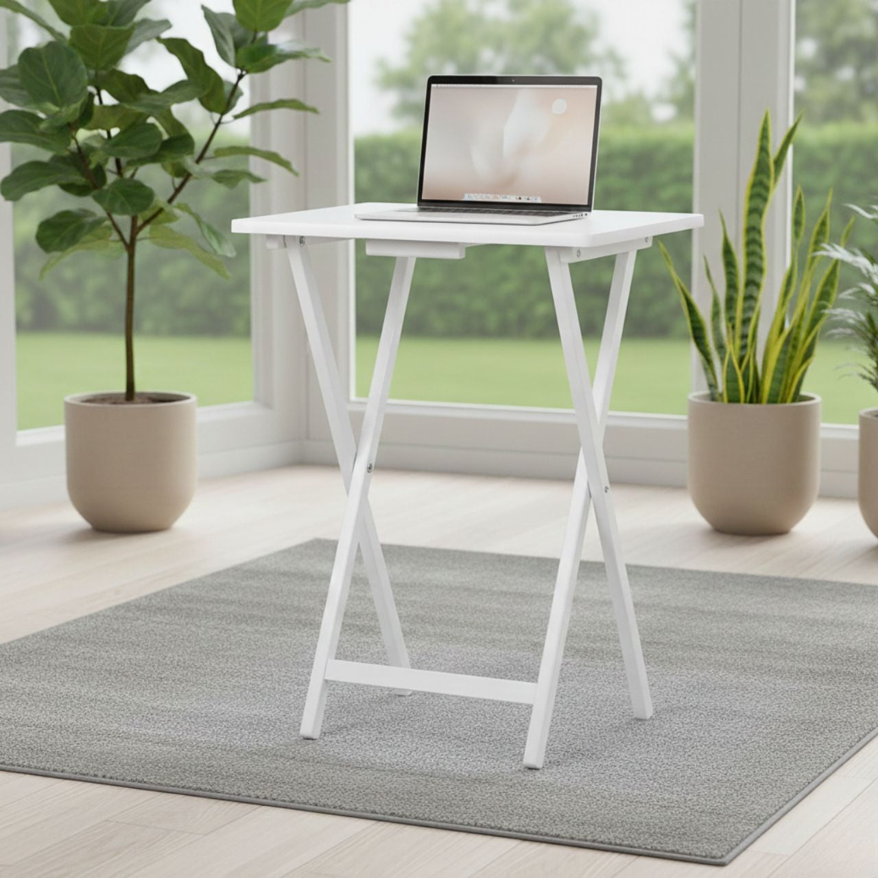 white wood-finish folding TV trays on a couch with a tablet in a bright living room.