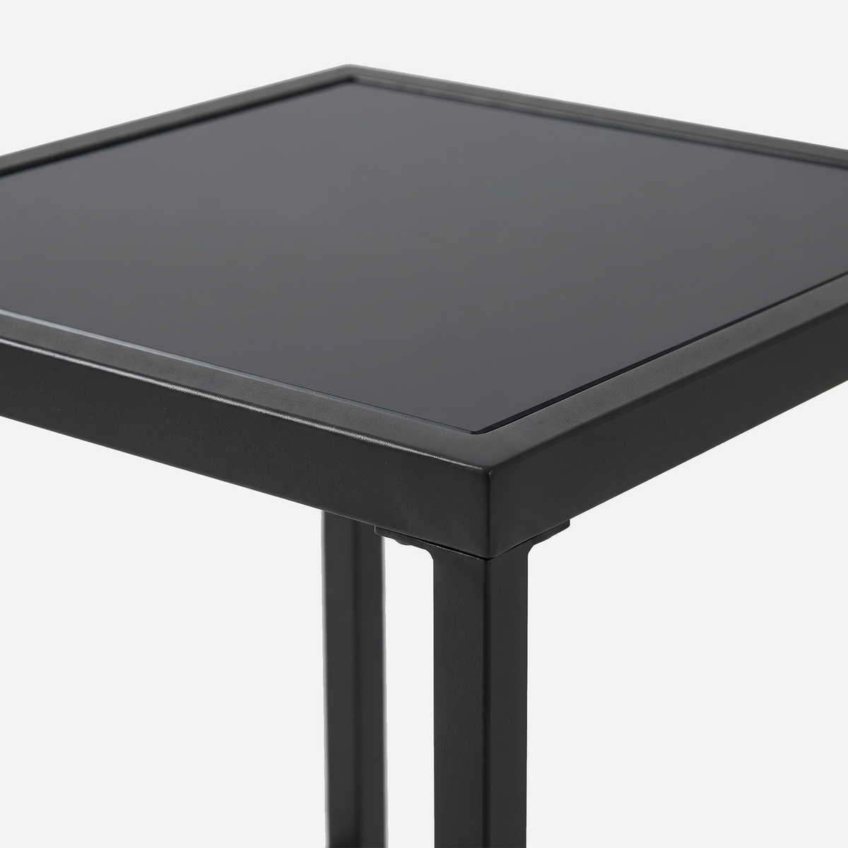 Close-up of the tempered glass top set in a slim black frame