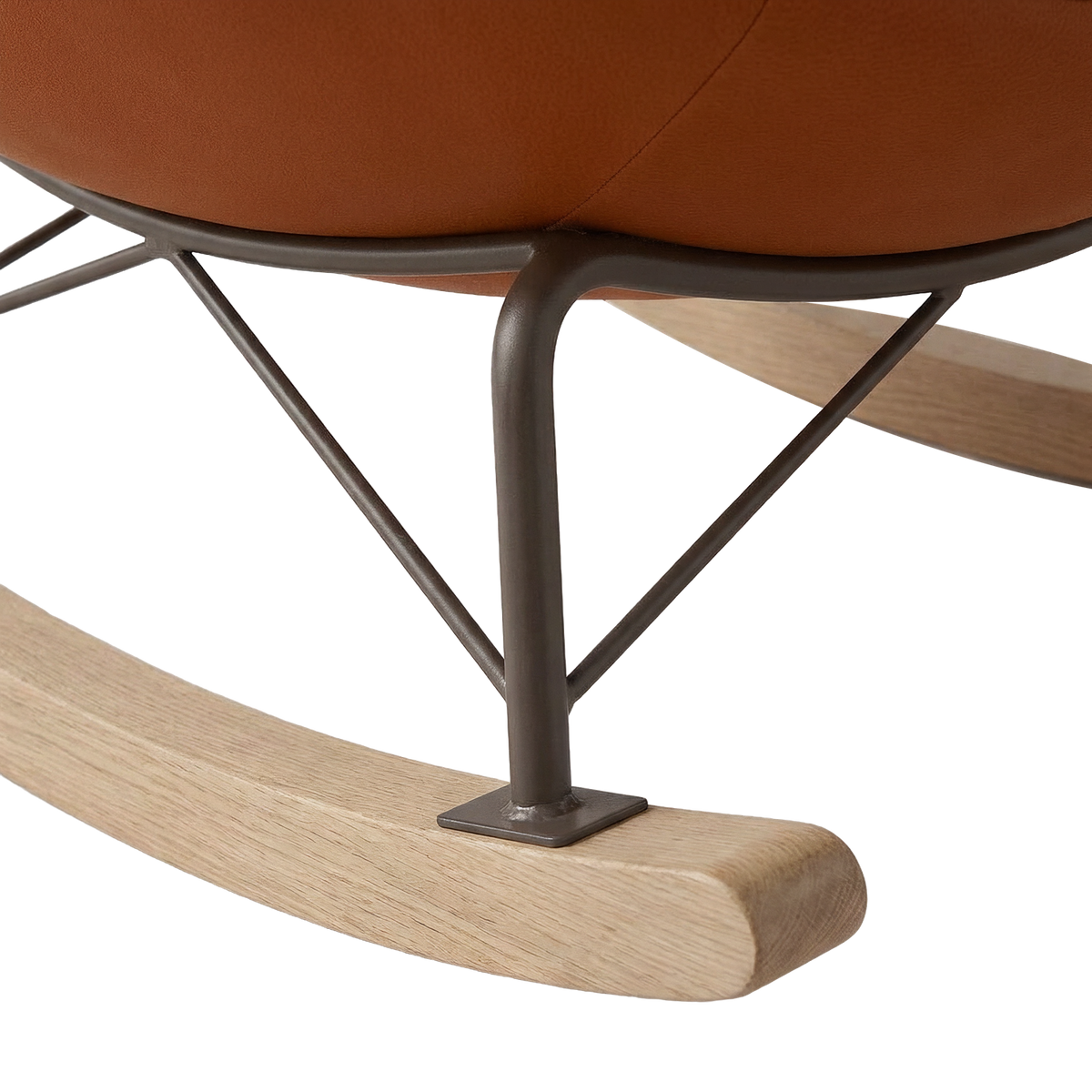 Metal rocking frame joint and cushion edge on the lounge chair (close-up detail)