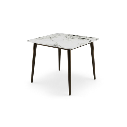 Square sintered stone dining table with dark bronze metal legs, rotated view on transparent background